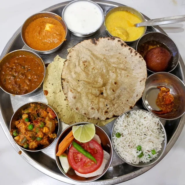 A plate filled with a variety of delicious vegetarian dishes