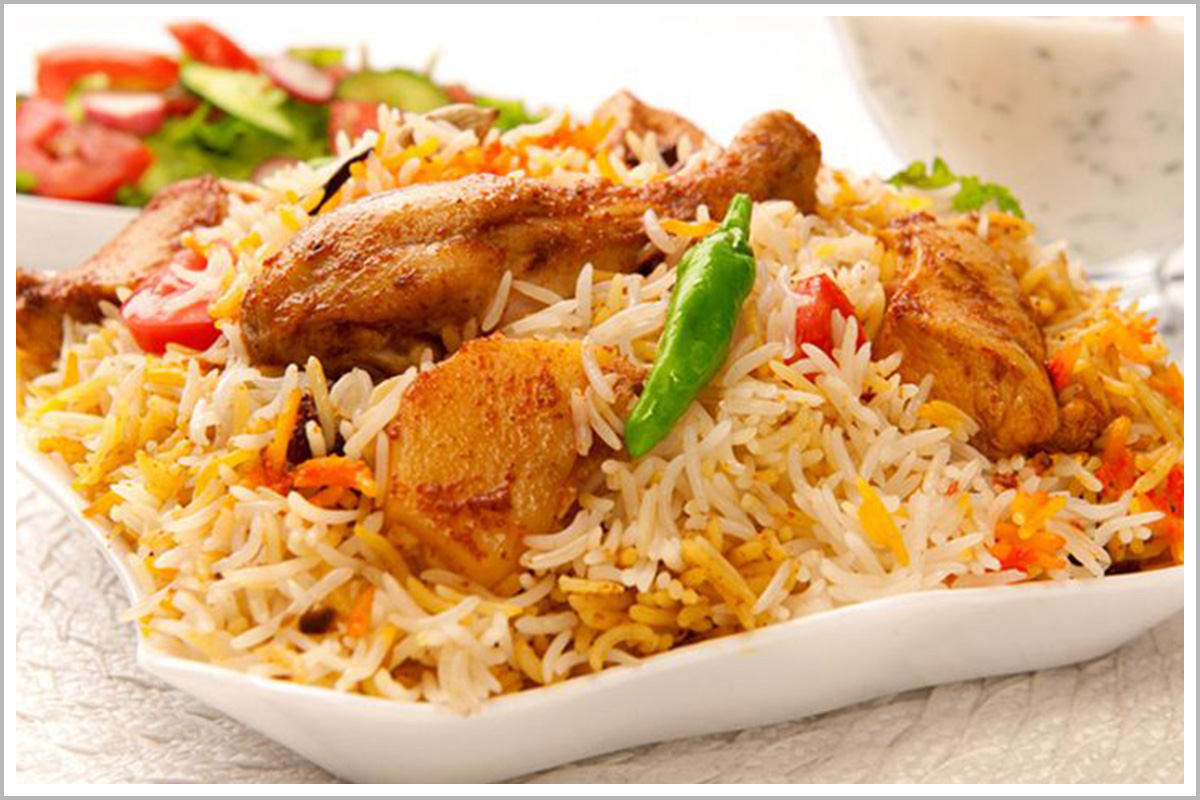 A plate of Biryani - rice with chicken and vegetables
