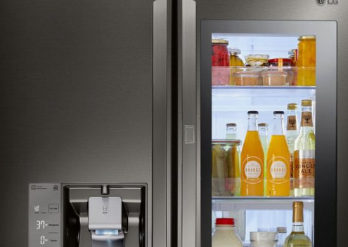  A refrigerator plugged into an electrical outlet, using energy to keep food cold and fresh