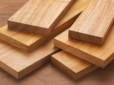 Beautiful Acacia wood boards neatly piled on a table