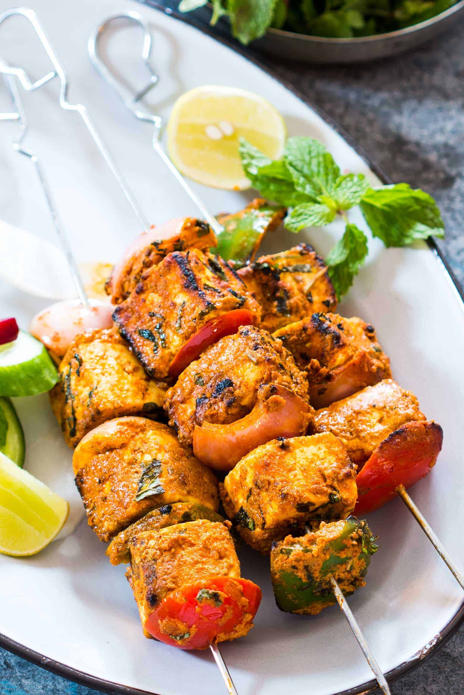Plate of chicken kebabs with vegetables