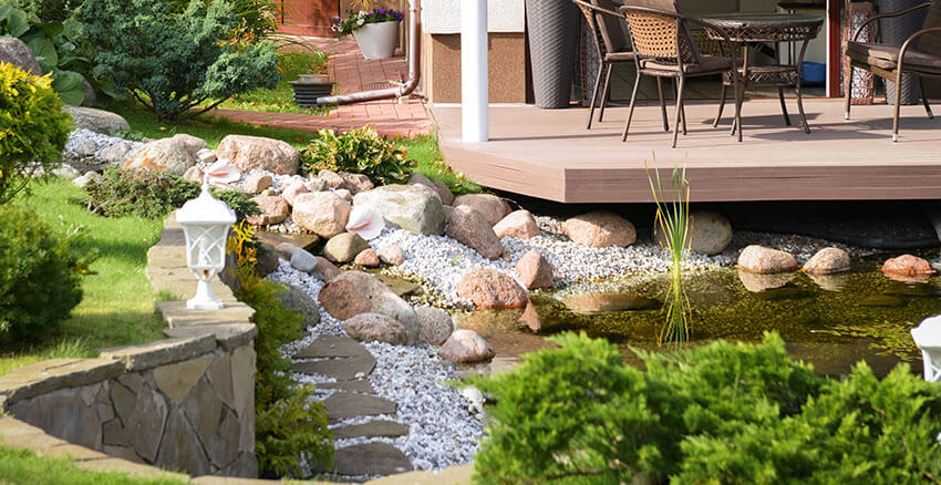 A tranquil outdoor space showcasing a pond and deck, with Public Land and Rock Collection