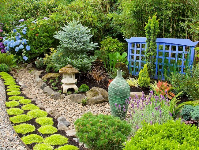 A garden featuring a stone path and a mix of plants