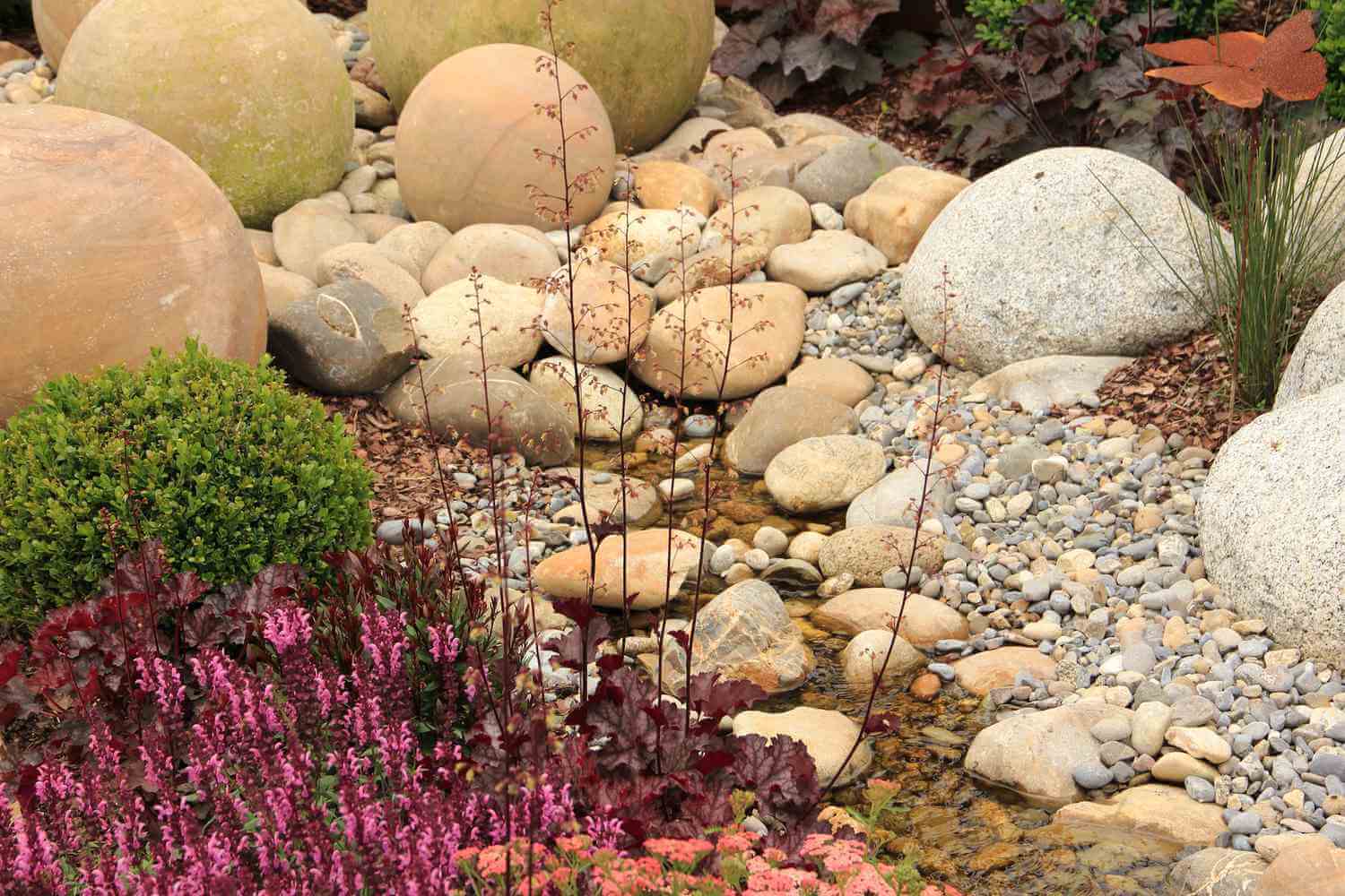 featuring River Rock for a natural and tranquil ambiance.