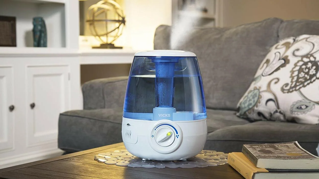 A humidifier on a table near a couch
