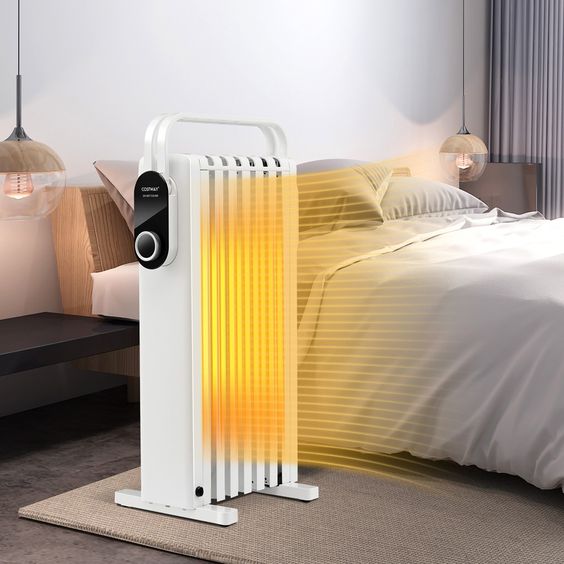 A white electric heater in a bedroom, providing warmth and comfort