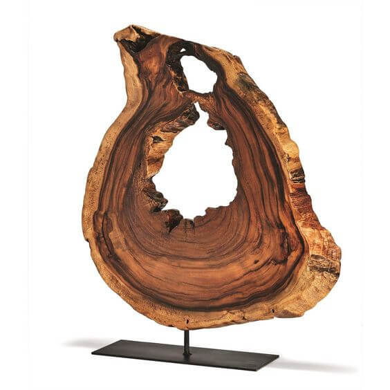A wooden sculpture with a hole in it