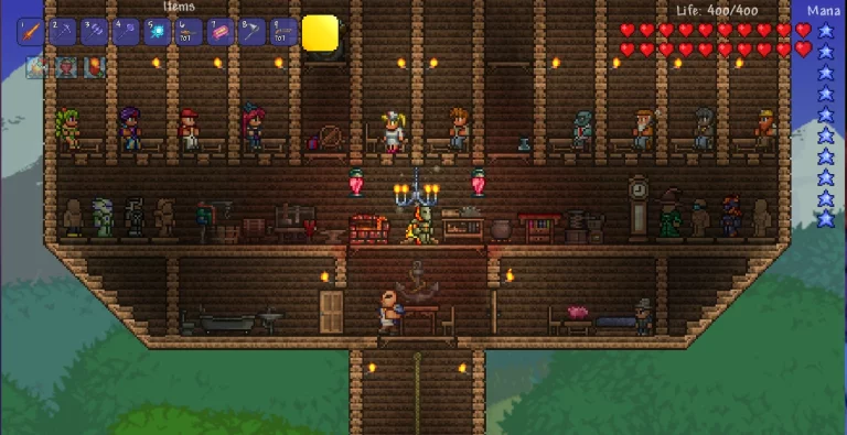 Screenshot of a game with a towering building in Terraria, showcasing basic house needs