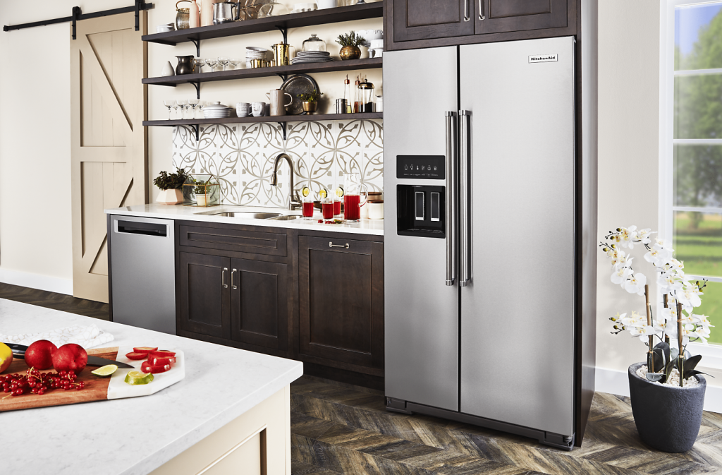 Standard size refrigerator with double doors, freezer on top, and a capacity of 20 cubic feet